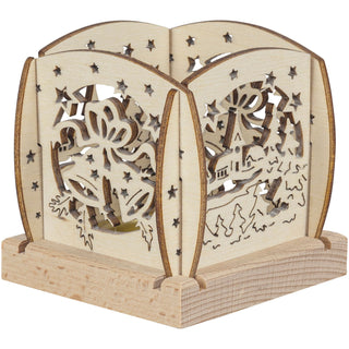 Kleiner Holz‑Kerzenhalter mit filigranen Glocken‑Ausschnitten, Sternmotiven und einer winterlichen Szenerie mit Häuschen und Tannen; gestaltet für ein einzelnes Teelicht.