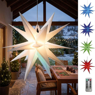 LED-Adventsstern mit Farbwechsel für den Außenbereich von HGD mit 60 cm Durchmesser, aufgehängt unter einer überdachten Terrasse. Der große, mehrzackige Stern leuchtet in warmweißem Licht und kann per Fernbedienung in verschiedene Farben wie Blau, Grün, Rot und Violett wechseln. Rechts im Bild sind die verfügbaren Lichtfarben sowie die Fernbedienung dargestellt. Die festlich dekorierte Terrasse mit Esstisch, Sitzkissen, Lichterketten bildet eine stimmungsvolle Kulisse für die Advents- und Weihnachtszeit.