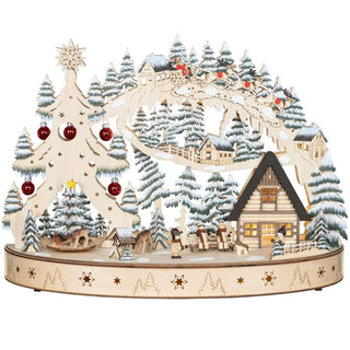 LED Lichterbogen „Weihnachtstraum“ mit beweglichem Weihnachtsbaum, roten Glaskugeln, winterlicher Holzszenerie, für Batterie- und Netzbetrieb mit Timerfunktion.