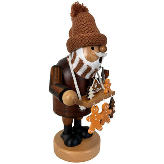 Farbiges Räuchermännchen „Lebkuchenhändler“ aus Holz, 21 cm hoch, mit gestrickter Mütze, Schal und kleinen Lebkuchen‑Anhängern. Seitenansicht rechts