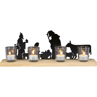 Kerzenhalter ‚Christi Geburt‘ mit schwarzer Silhouette der Weihnachtsgeschichte auf Holzsockel, 41 cm lang, mit vier Glashaltern für Teelichte – besinnliche Weihnachtsdekoration.