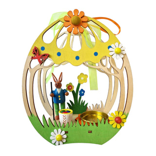 Teelichthalter in Eiform mit einem Osterhase und farbenfrohen Details