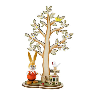 Farbiger Osterhase mit Blütenbaum, Schubkarre mit Ostereiern und Schild mit der Aufschrift Frohe Ostern