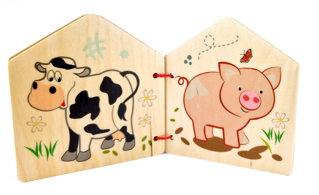 Bilderbuch aus Holz mit Kuh und Schwein
