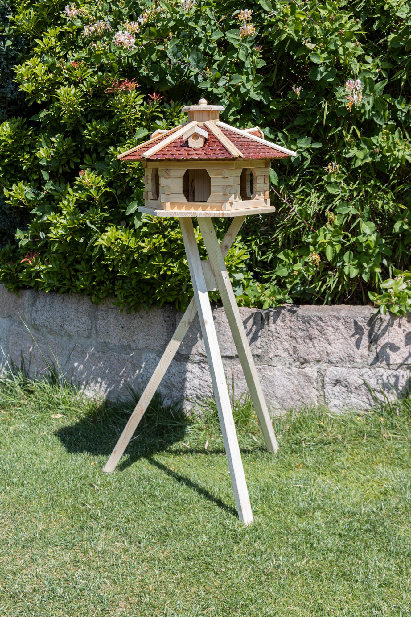 XXL wooden bird house with brown roofing felt shingle roof