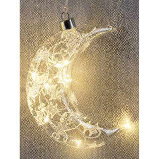 Hochwertige LED Glasdekoration mit Dekor in Kristall/Frost Optik. Die Höhe des Glasmonds beträgt 16 cm. Der Mond aus Glas&nbsp;wird mit einer LED beleuchtet und die Stromversorgung funktioniert über ein im Aufhänger verstecktes Batteriefach. Zusätzlich hat die Glasdekoration eine Timer Funktion._2