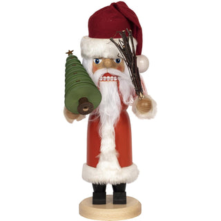 Der 36cm große Weihnachtsmann als Nussknacker hat eine rote Stoffmütze, schwarze Stiefel, einen roten Holzkörper als Mantel und weißer Fellumrandung. Er trägt eine grüne Holztanne in den Händen und eine Rute aus kleinen Zweigen. Das weiche weiße Haar und der lange Bart  macht diesen Nussknacker zu etwas Besondern. In 3 Farben ist diese Figur erhältlich. Bild 1.