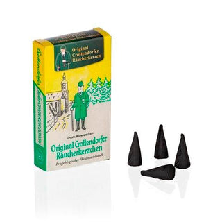 Räucherkerzen Nostalgie Weihnachtsduft. Schachtel „Original Crottendorfer Räucherkerzen – Erzgebirgischer Weihnachtsduft“ mit vier schwarzen Räucherkerzen vor traditionellem Motiv.