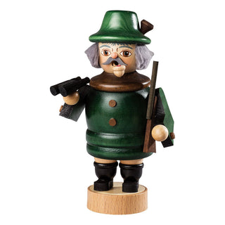 Hier sieht man einen 20cm-großen Jäger mit weichem Haar, Fernglas, Gewehr und Pfeife im Mund. Das Räuchermännchen hebt man von den Beinen ab, um eine Räucherkerze abzulegen. Damit hat man zusätzlich einen besinnlichen Weihnachtsduft im Raum.