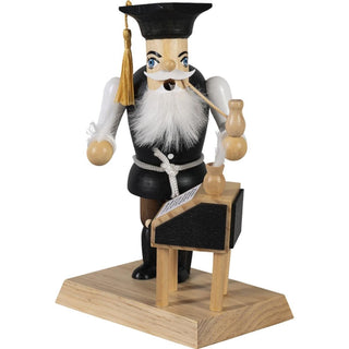 Farbiges Räuchermännchen Lehrer mit Schreibtisch und Tintenfässchen. In der Hand hält er seine Schreibfeder und seine Pfeife._1