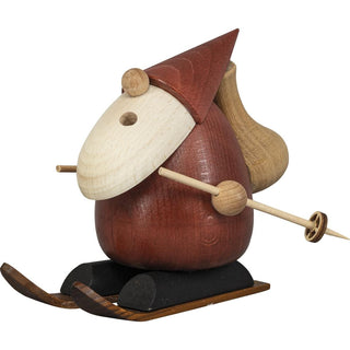 Der ca. 14 cm-große wohlgeformte Weihnachtsmann aus Holz fährt auf  Schneeschuhen. Zur Mundöffnung aus dem weißen Bart kommt der Dampf heraus. Die Stiefel sind schwarz, die Kleidung ist rot und die Nase, der Rucksack, die Skiausrüstung und auch die Hände sind naturfarben. Die Figur hebt man von den Füßen ab, um eine Räucherkerze abzulegen. Damit hat man zusätzlich einen besinnlichen Weihnachtsduft im Raum. Diese Figur ist in verschiedenen Motiven erhältlich.  Bild 6.