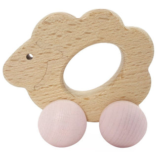 Schiebefigur aus Holz "Rolli Schaf". Das Schäfchen ist naturfarben und die Räder sind rosa. 
